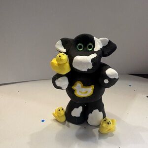 Black and White Cow with Yellow Ducky’s